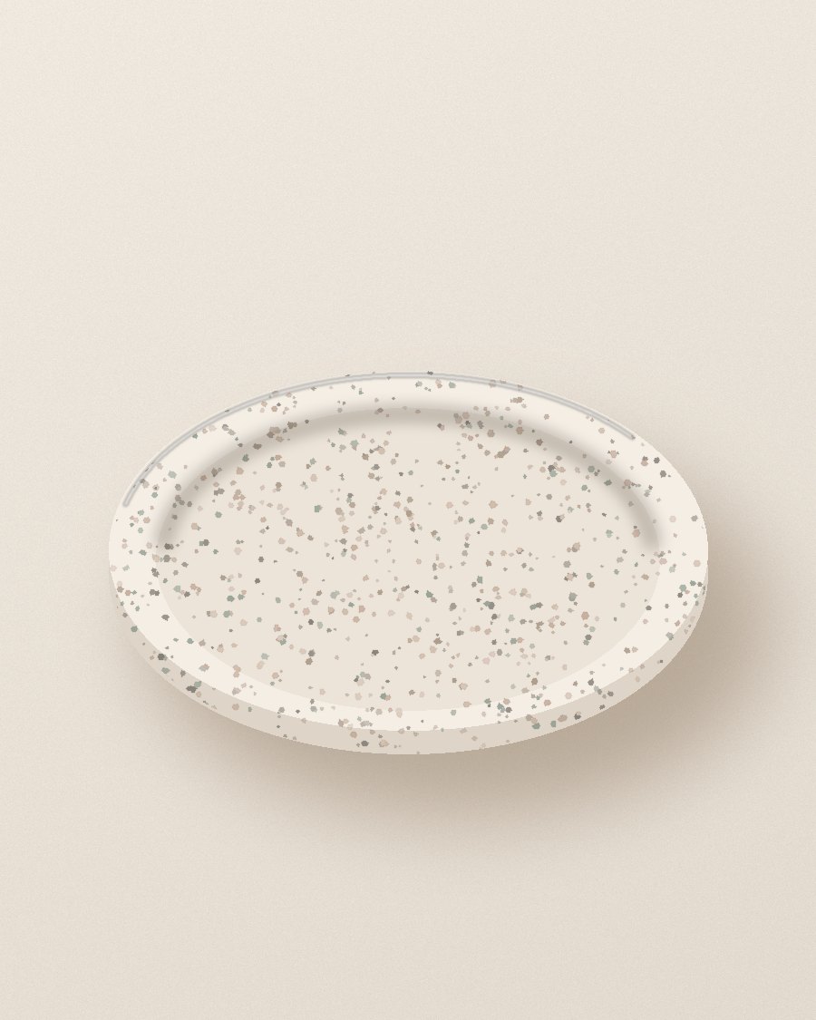 A speckled cream Jesmonite trinket dish