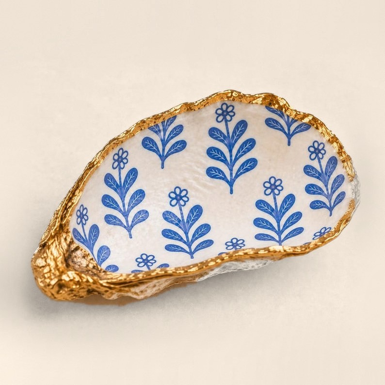 Blue Botanical Sprigs oyster shell ring dish with a gold leaf edge