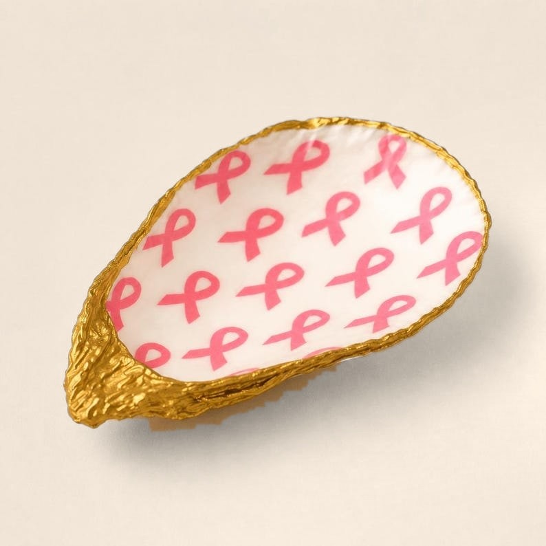 Pink Ribbon oyster shell ring dish with a gold leaf edge