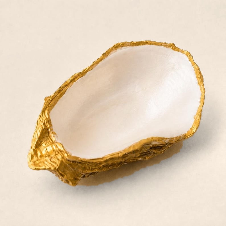 Pearl White oyster shell ring dish with a gold leaf edge